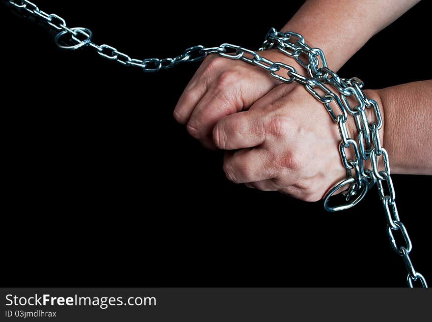 Hands in chain on a black background