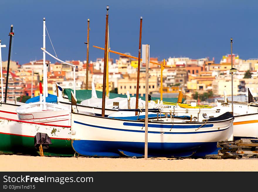 Colorful boats rest on the Spanish coast