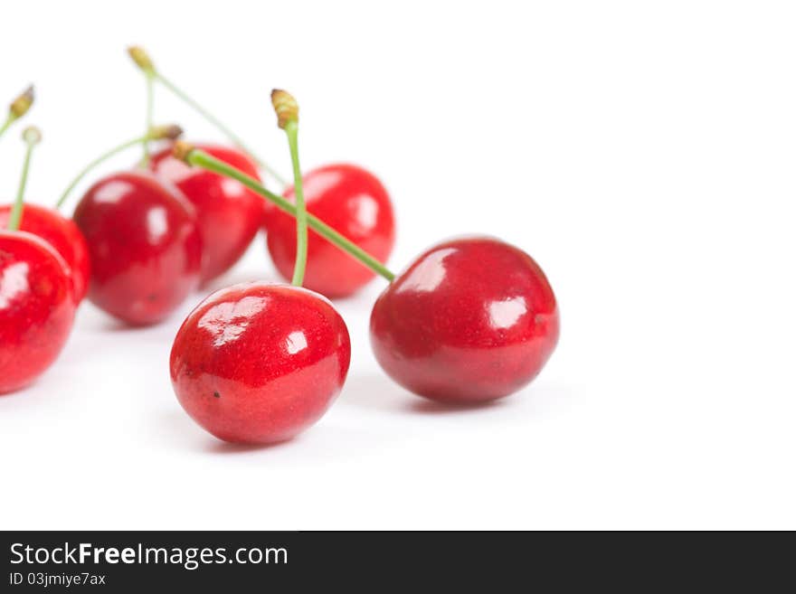 Red ripe cherries isolated on a white background