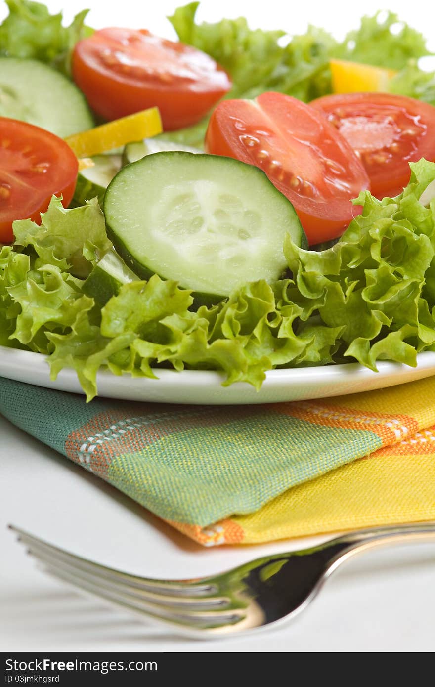 Fresh salad on white plate