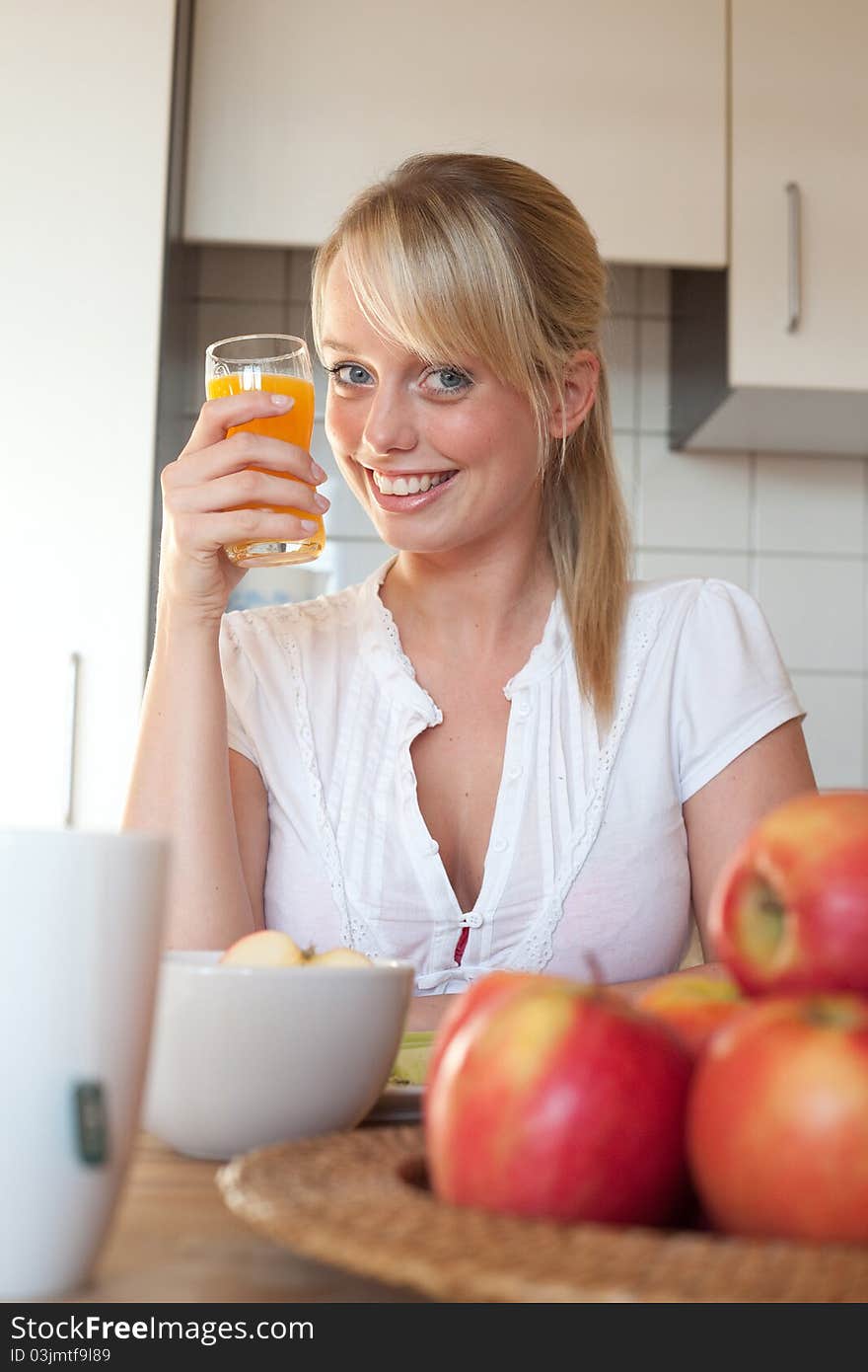 Young Blond Woman With Her Breakfast