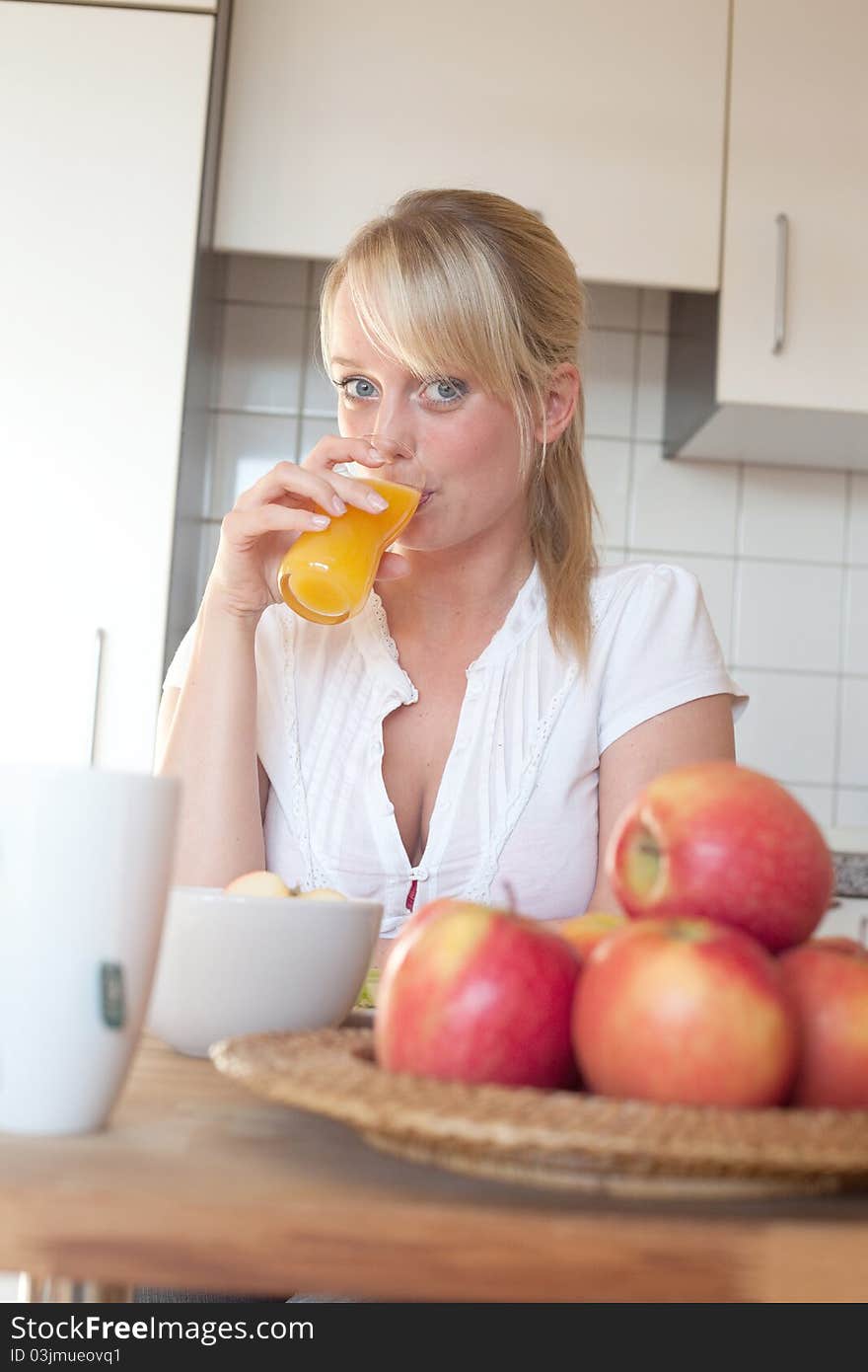 Young Blond Woman With Her Breakfast