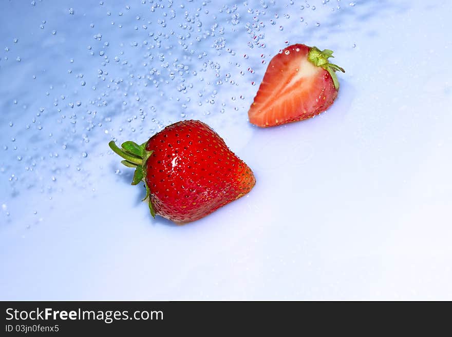 Strawberry in water splash