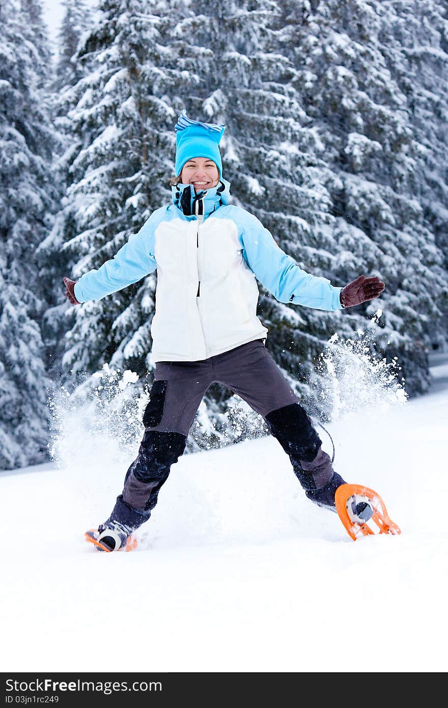 Hiker girl jumps in snow. Hiker girl jumps in snow