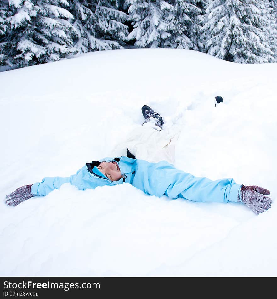 Hiker girl lying in snow. Hiker girl lying in snow