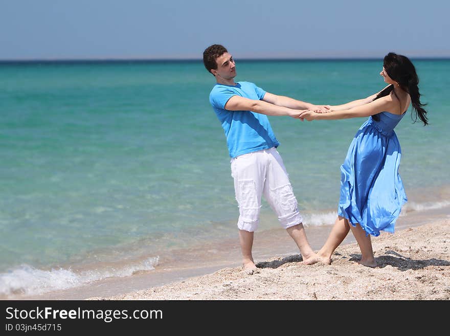 Young loving couple on beach. Young loving couple on beach