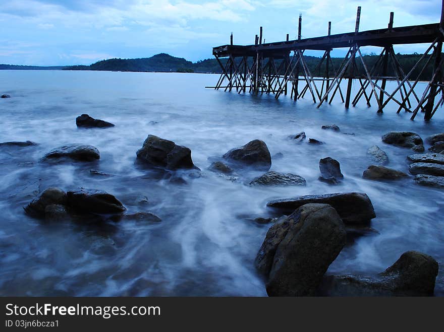 Wood Bridge And Wave