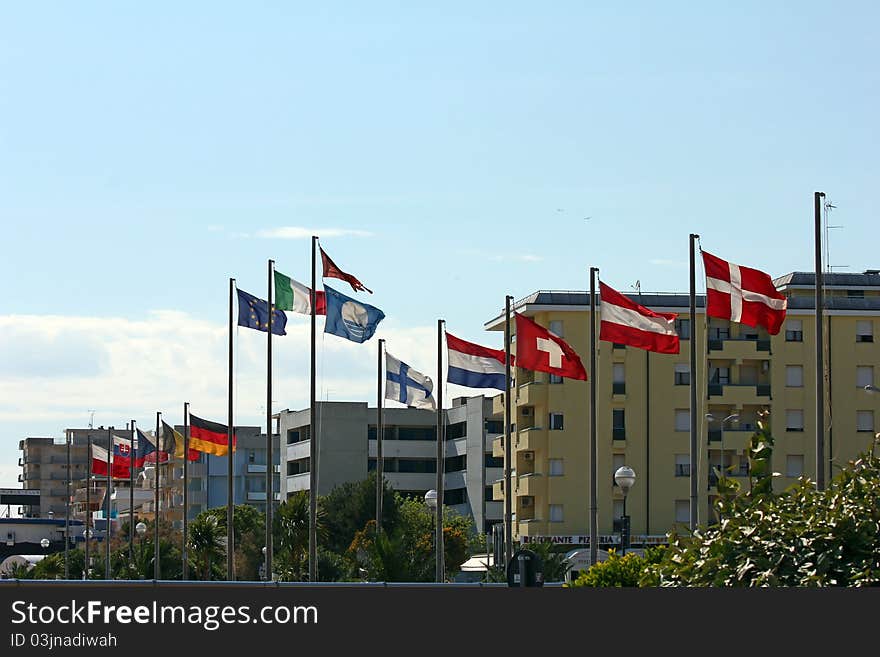 Several european flags at the coast