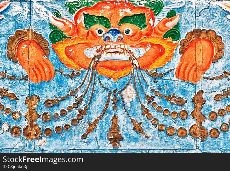 Details from Shanti Stupa main wall representing one of the demons of uninterrupted reincarnation. Details from Shanti Stupa main wall representing one of the demons of uninterrupted reincarnation.