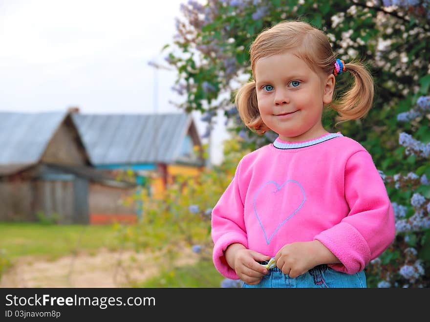 Smiling girl in pink coat