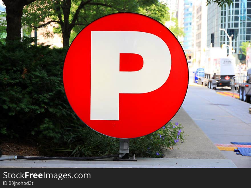 A white P of Parking on red background