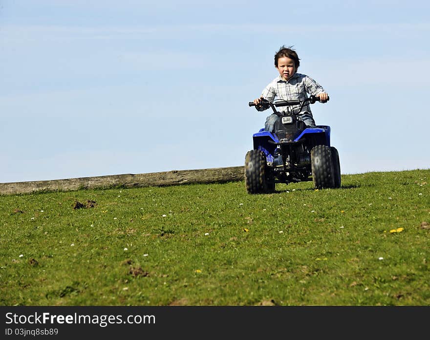 Boy driving ATV