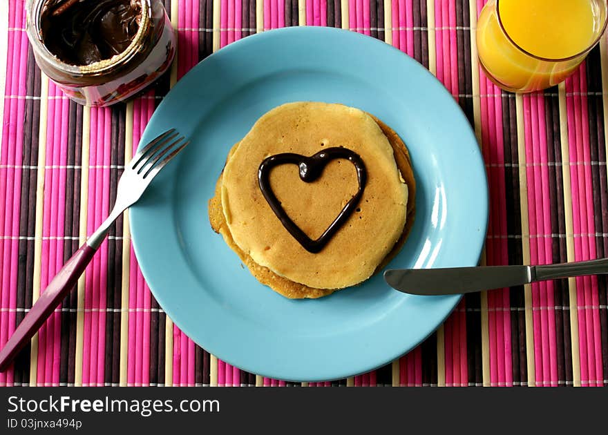 Homemade pancekes with chocolate and orange juice. Homemade pancekes with chocolate and orange juice