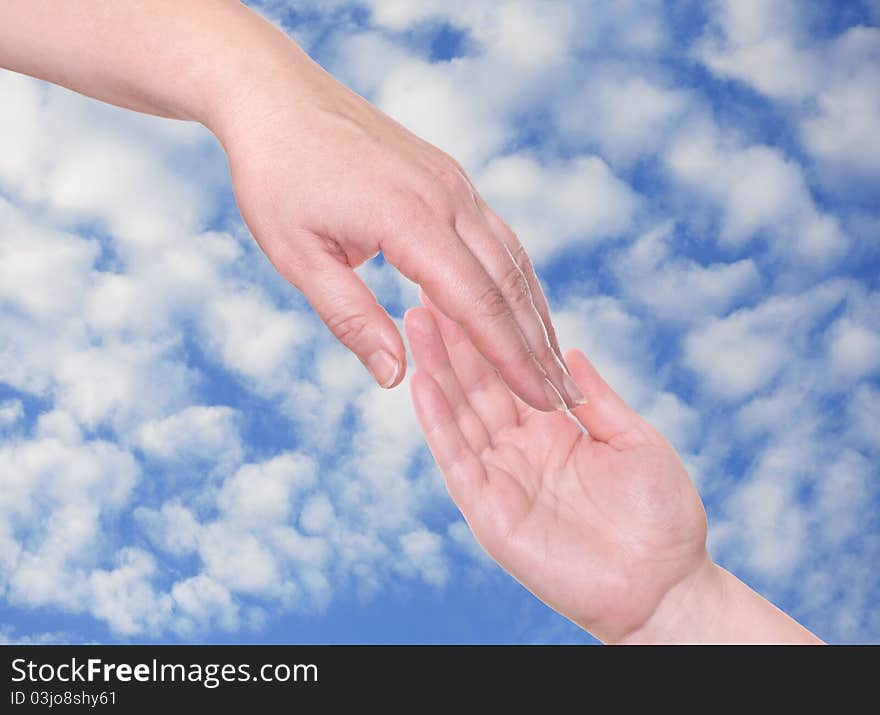 Two palms incorporate together on a background of the blue sky