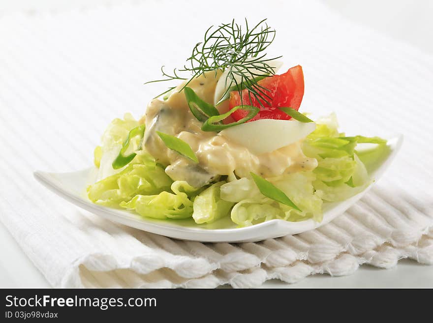 Egg salad on a nest of fresh lettuce