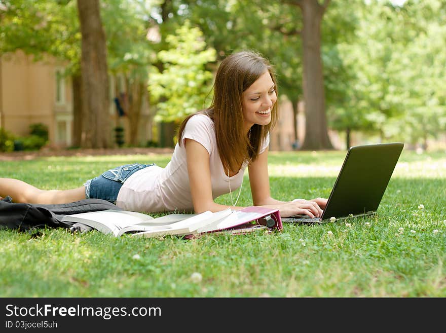 A pretty young college or high school age girl with study materials. A pretty young college or high school age girl with study materials