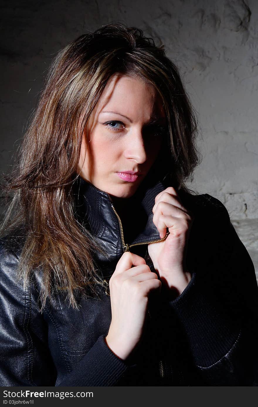 Portrait young woman in leather jacket