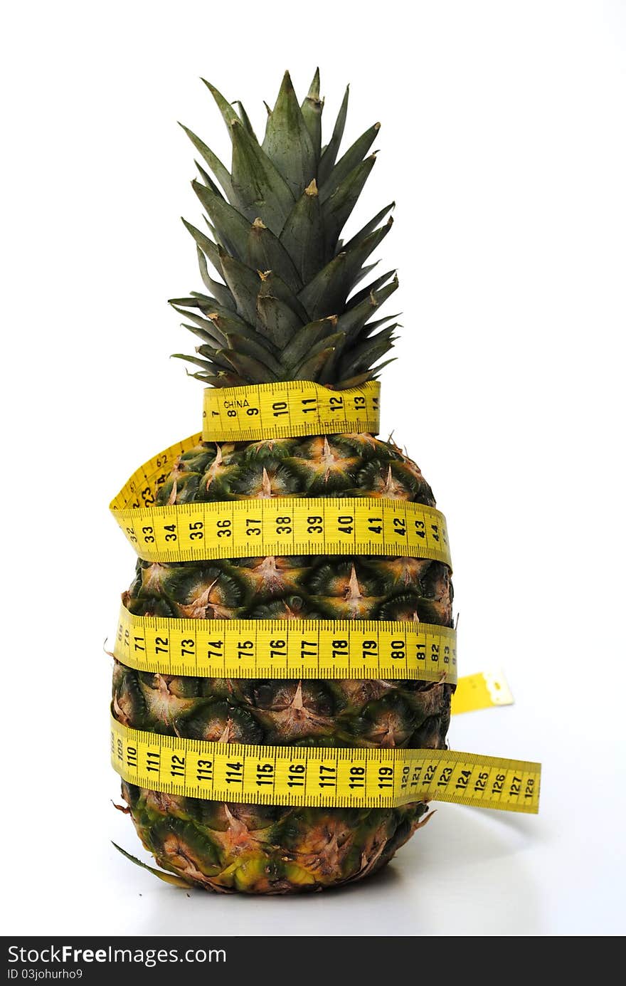 Ananas with tape rule. concept of diet