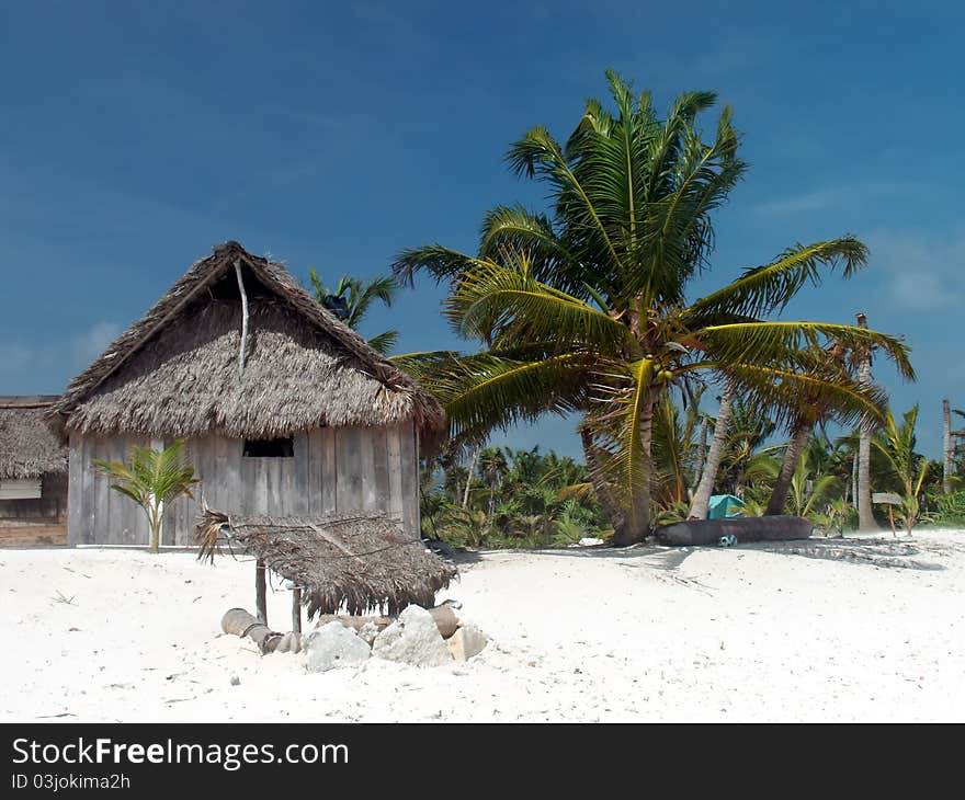 Coconut palm leaves hut on the caribbean beach. Coconut palm leaves hut on the caribbean beach.