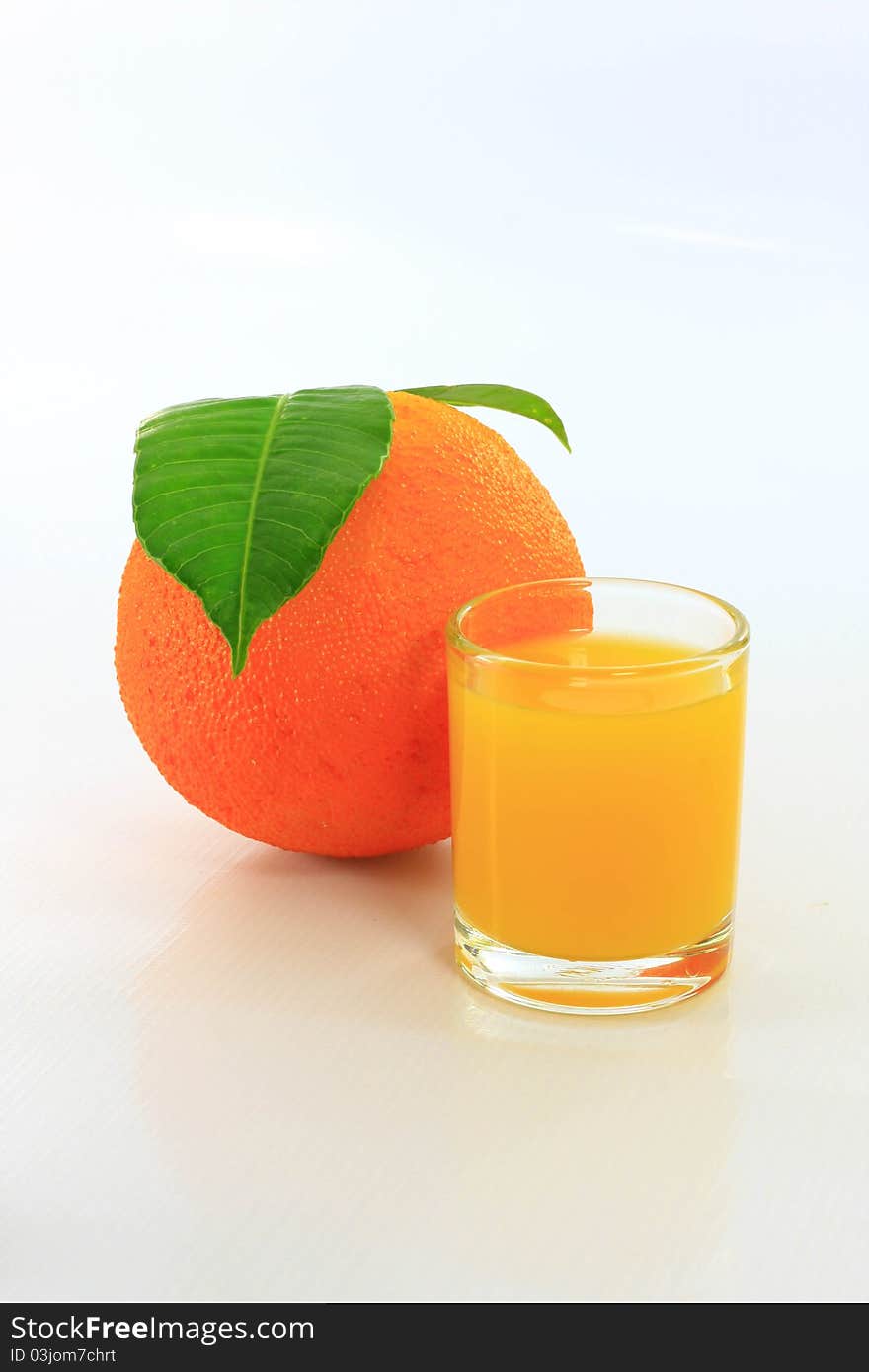 Orange juice in glass on white background. Orange juice in glass on white background