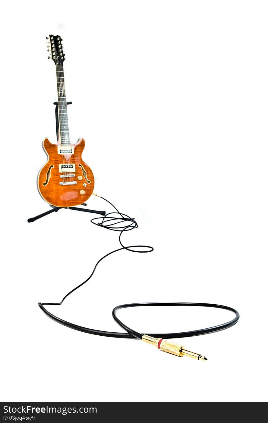 Orange Electric Guitar And Cord Isolated On White