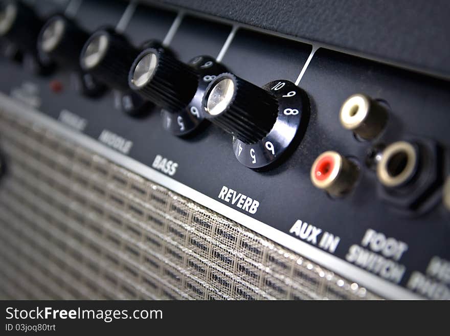 Closeup of amplifier controls with reverb knob highlighted