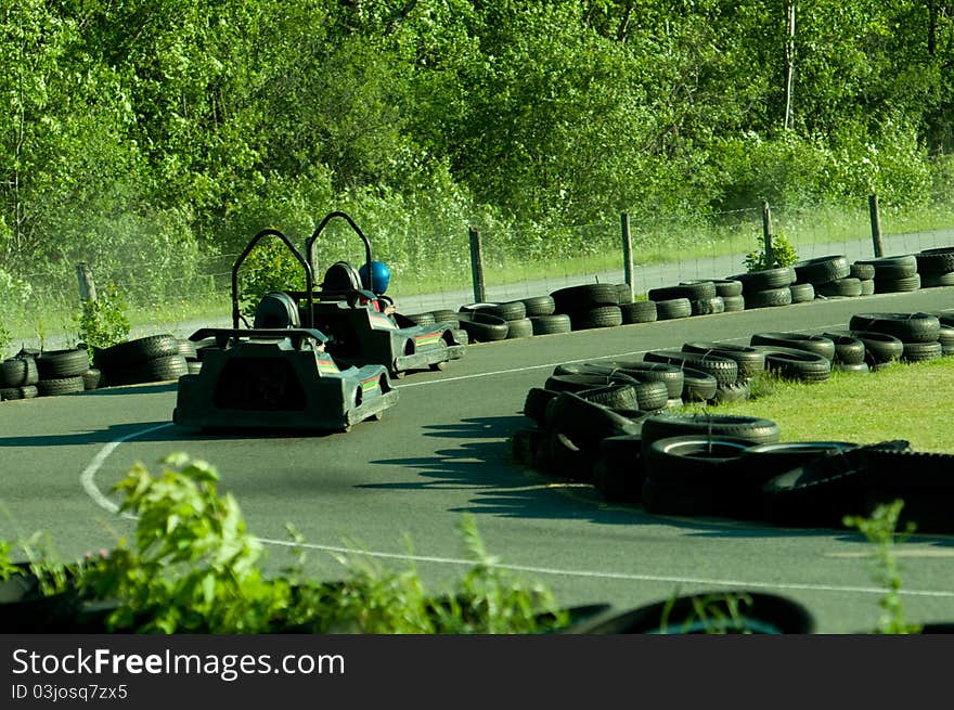 Two carts on a go-cart track. Two carts on a go-cart track