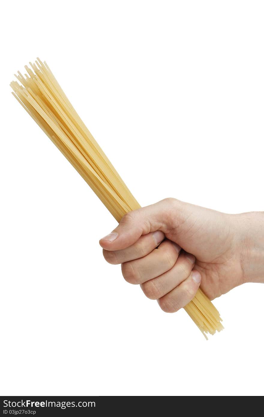 Man s hand holding a handful of spaghetti.