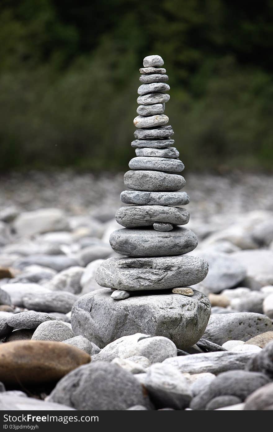 Beautiful pyramids made of pebble stones in zen garden outdoors