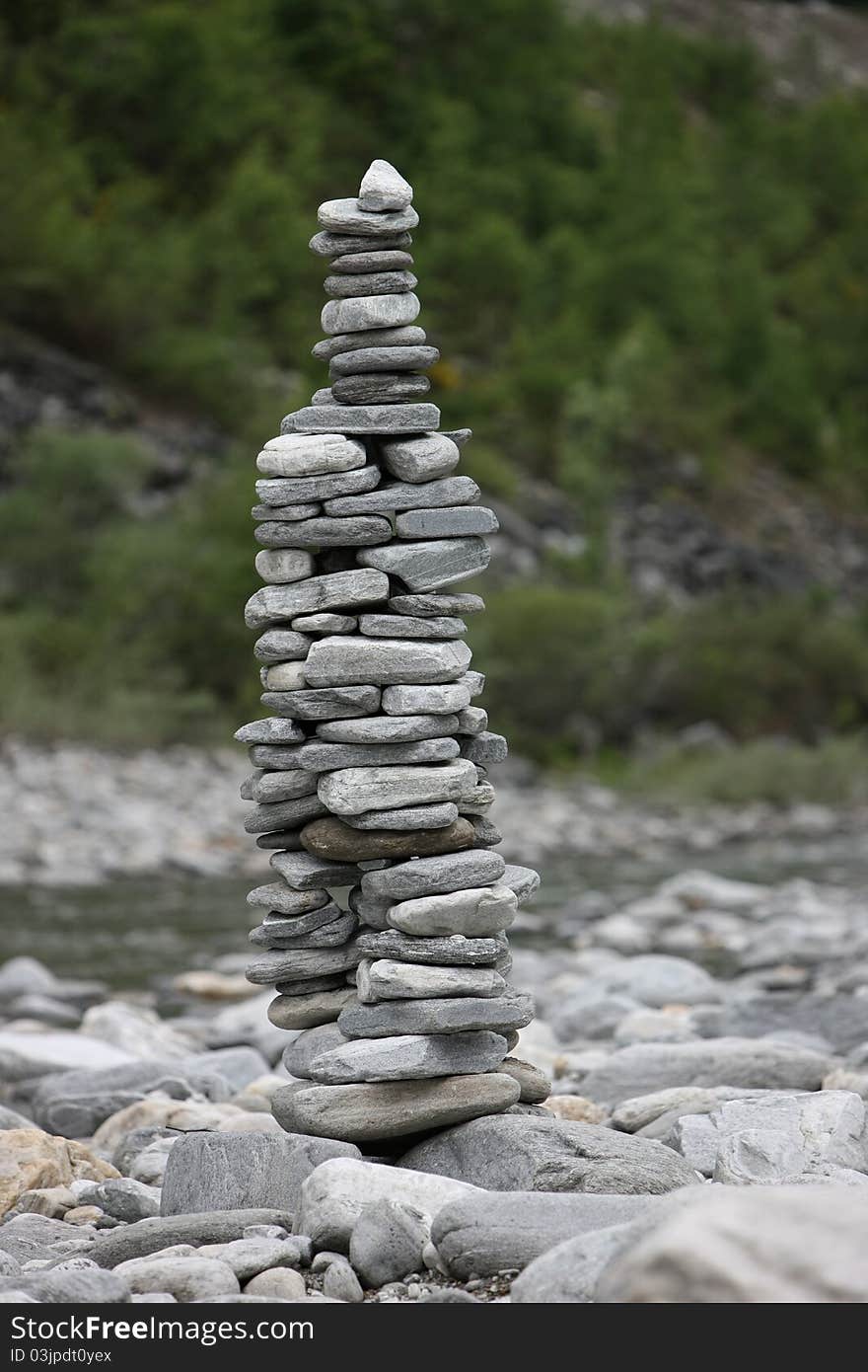 Beautiful pyramids made of pebble stones in zen garden outdoors