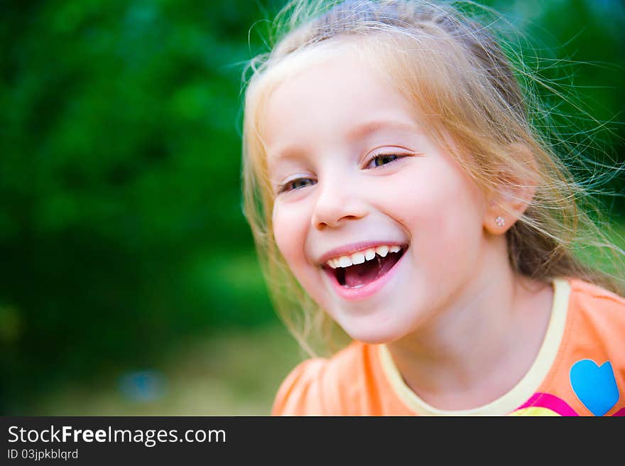 Cute little girl  on the meadow