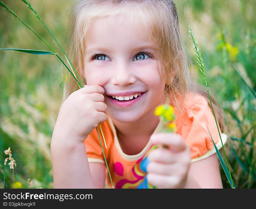 Cute Little Girl  On The Meadow