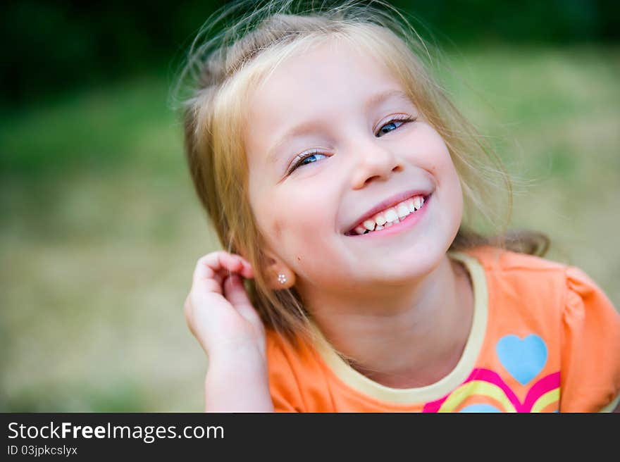 Cute Little Girl  On The Meadow