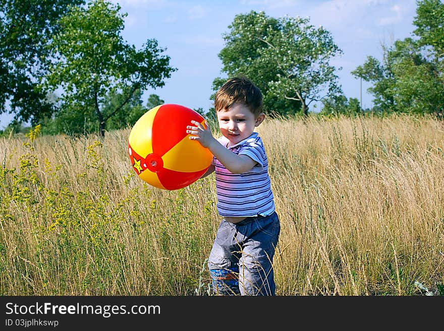 Thoughtful look of child with a ball