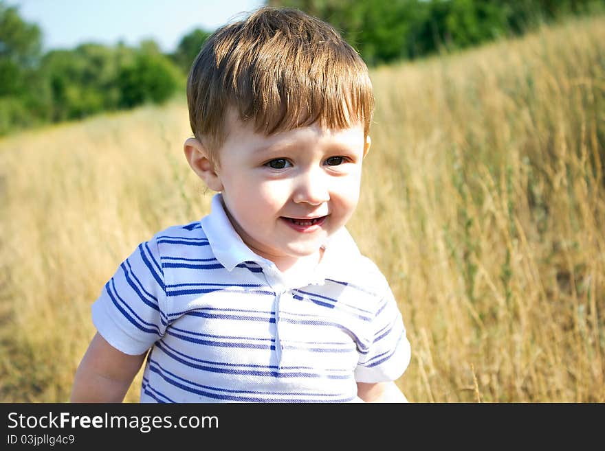 Bright, sun day. Portrait with the child, of charming glance. Bright, sun day. Portrait with the child, of charming glance