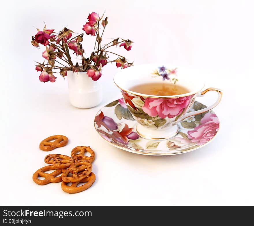 Cup of tea and some cookies white, pink