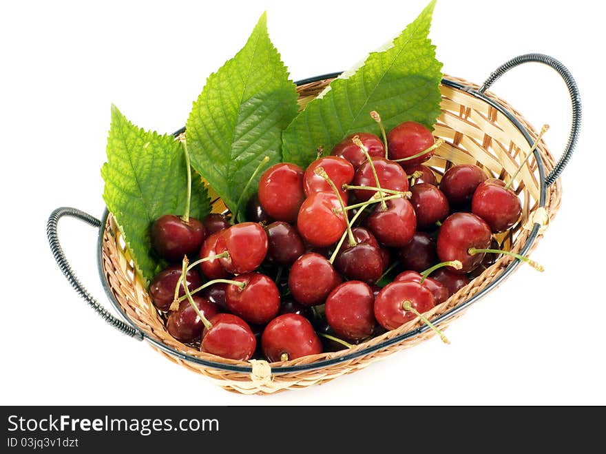 Cherry in basket on white background