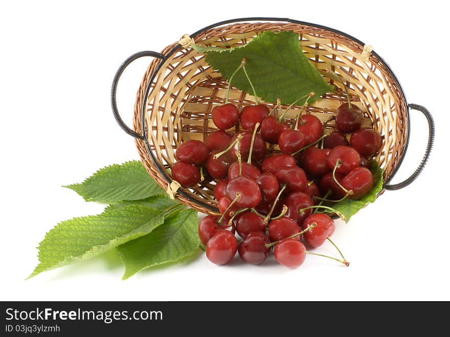 Cherry in basket on white background