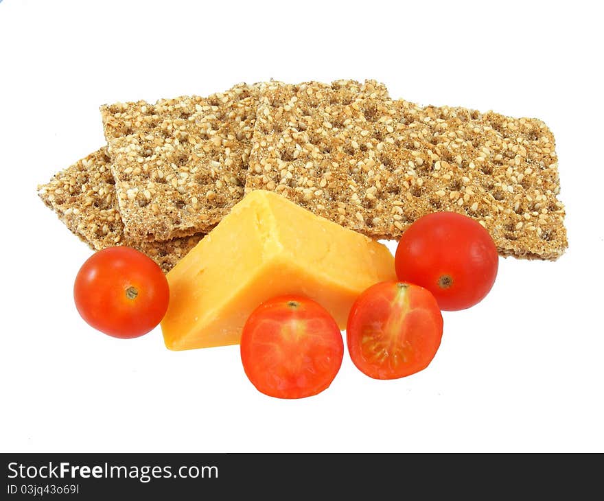 Crispbread, cheese and tomatoes isolated. Crispbread, cheese and tomatoes isolated