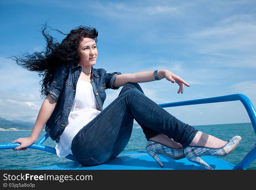 A  young woman on a yacht at sea