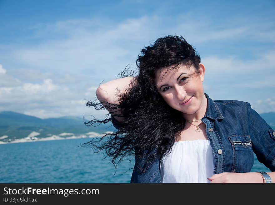 A  young woman on a yacht at sea