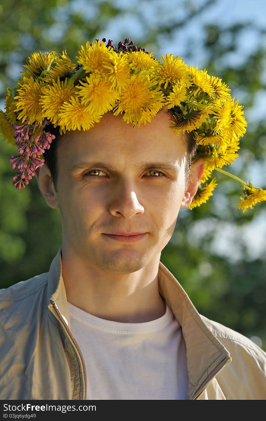 Man in nature with chaplet on head. Man in nature with chaplet on head