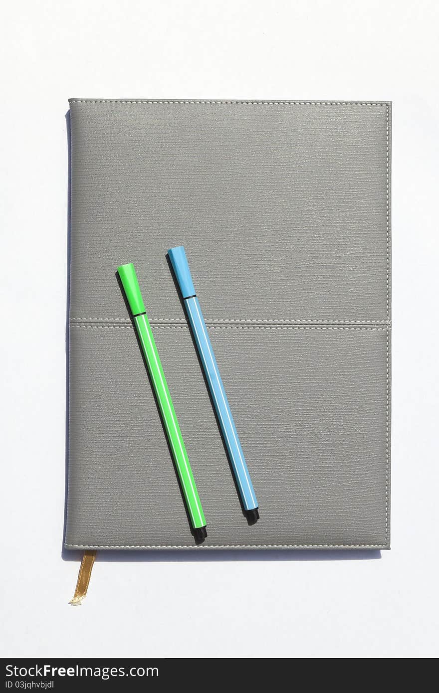 Gray notebook and pen, 2 pcs white background.