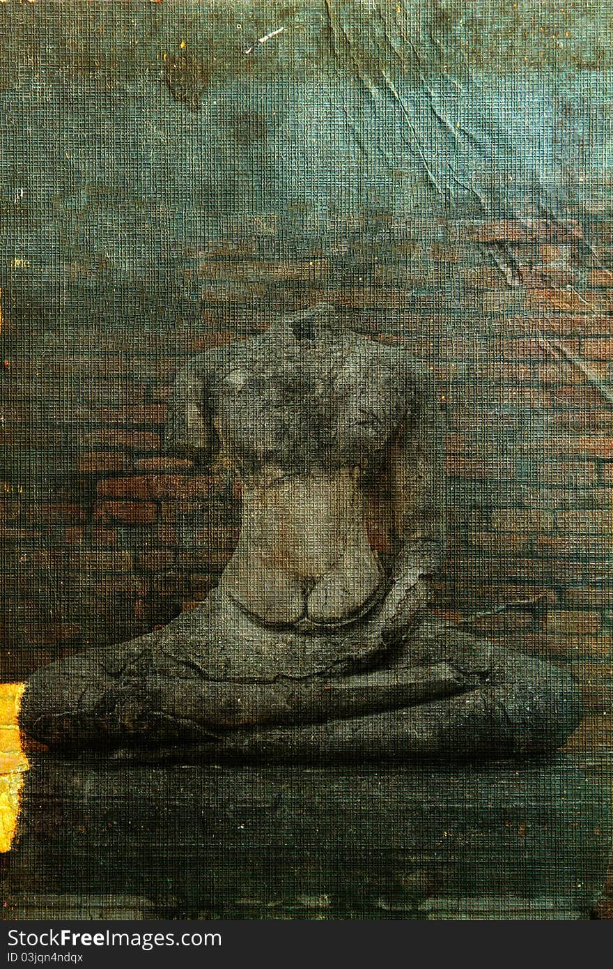 Buddha statue broken on old book