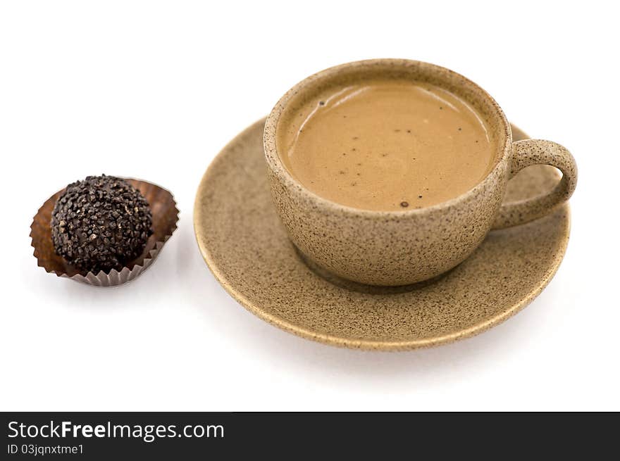 A Cup with Coffee  Beside a Candy