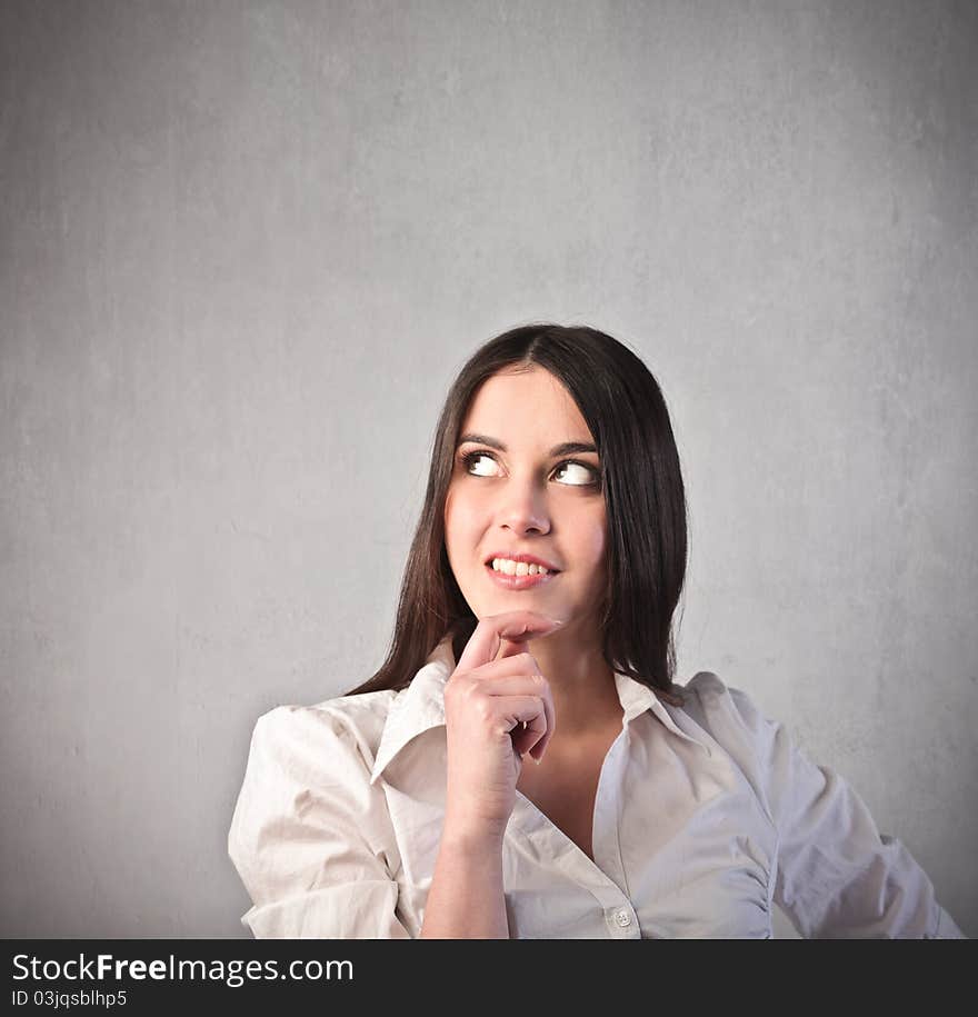 Young businesswoman with thoughtful expression. Young businesswoman with thoughtful expression