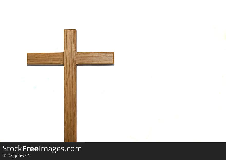 Wooden cross isolated against white background with copy space. Wooden cross isolated against white background with copy space