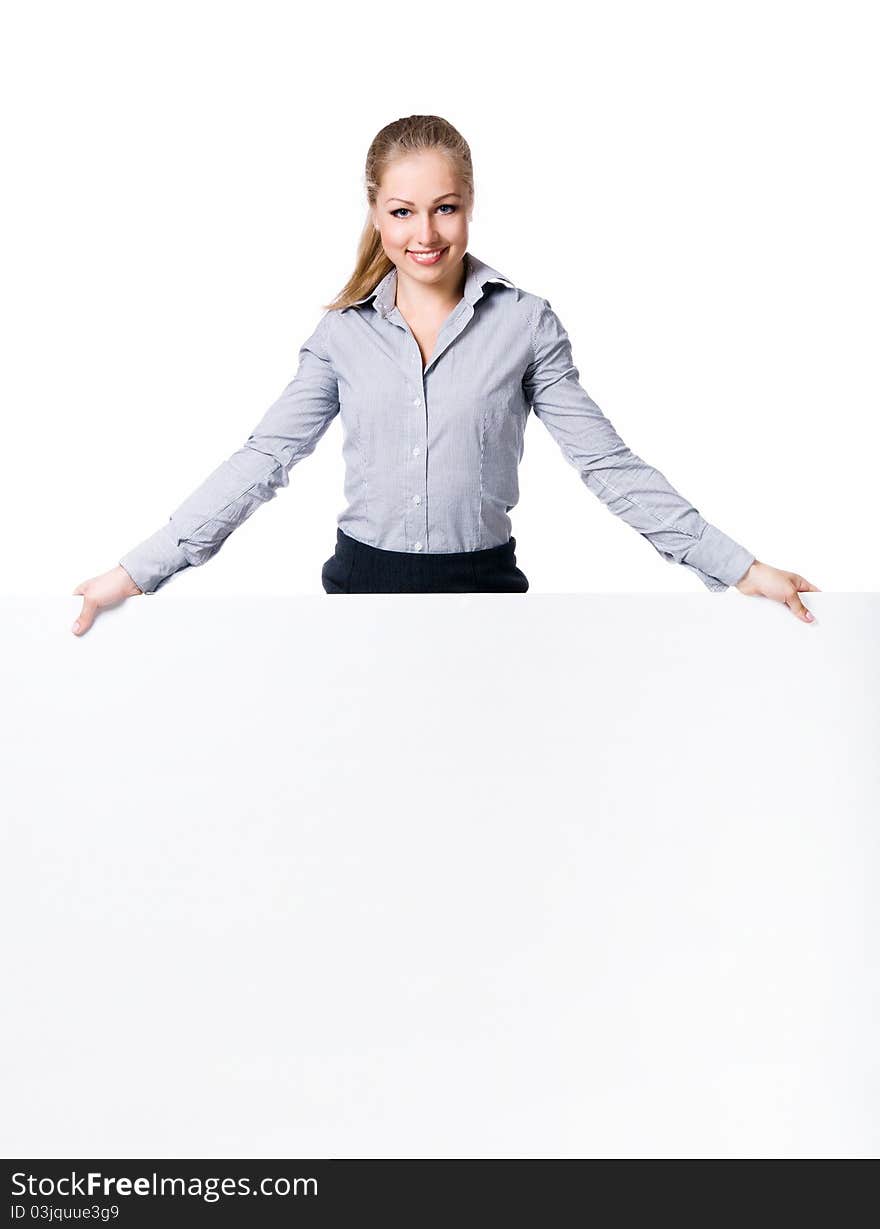 Businesswoman standing behind blank whits billboard. Isolated over white