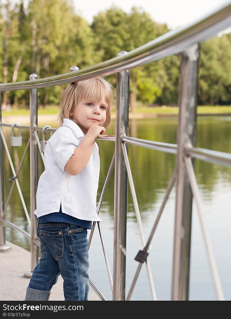 Funny little boy an the central park