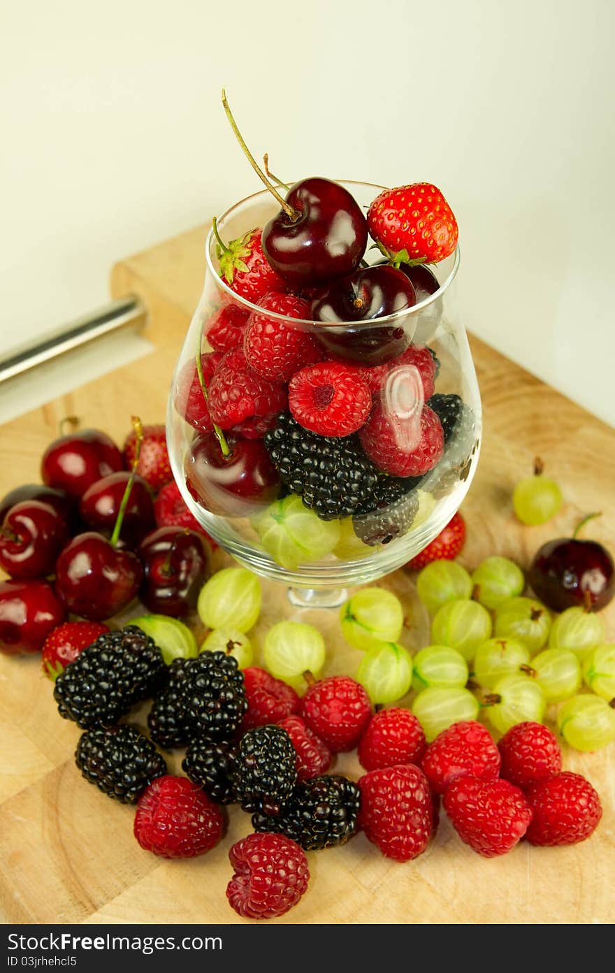 A range of succulent summer berries in a glass. A range of succulent summer berries in a glass